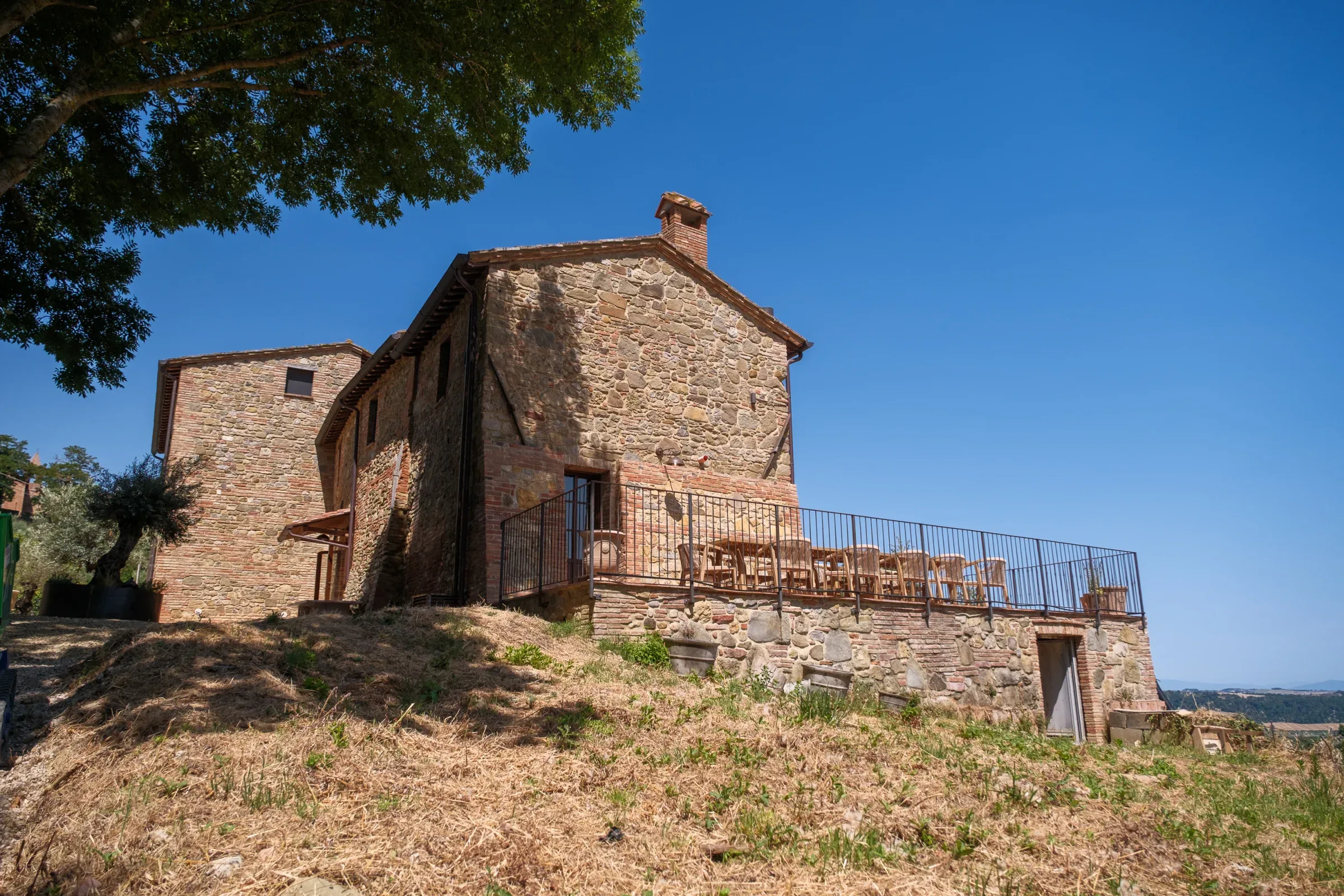 Stone villa and terrace seen from the garden