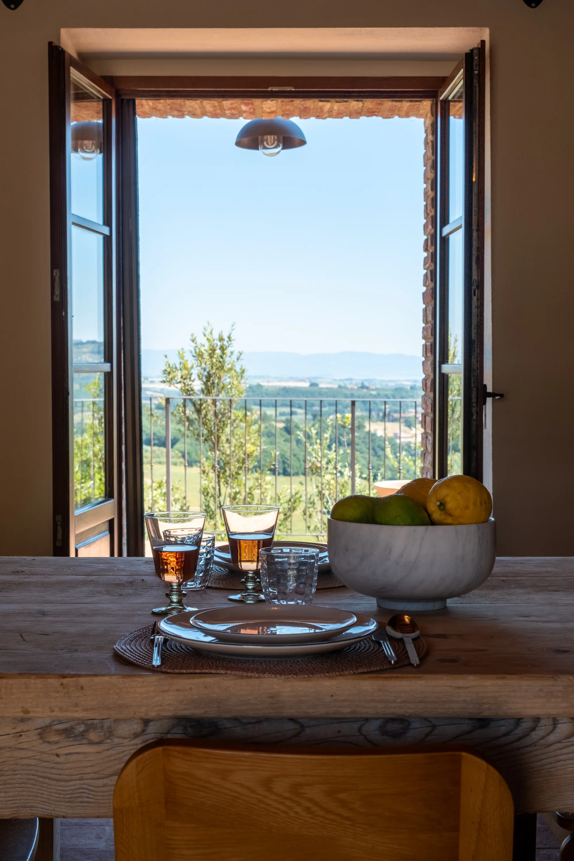 Dining room bathed in light from its tall window