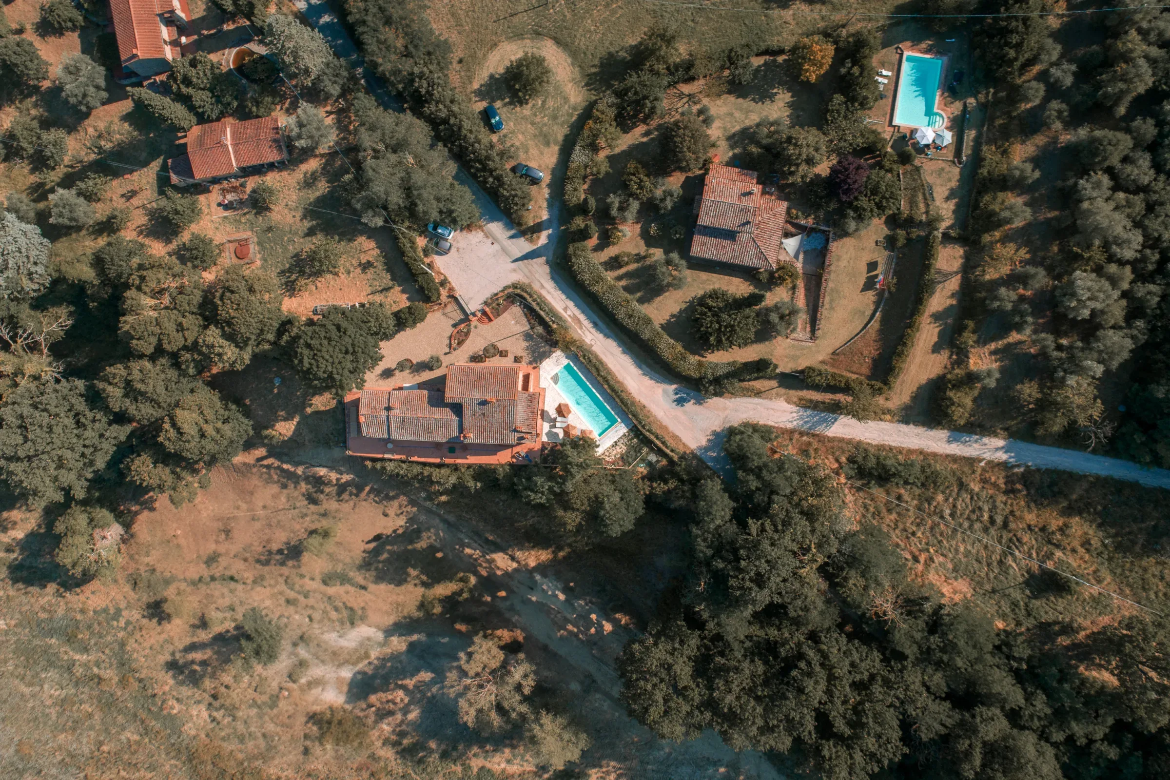 Villa and pool seen from above within the grounds