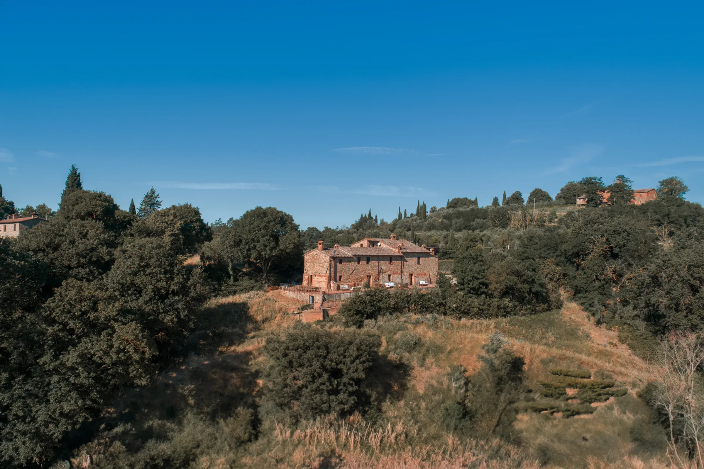 Stone villa at the edge of the woods